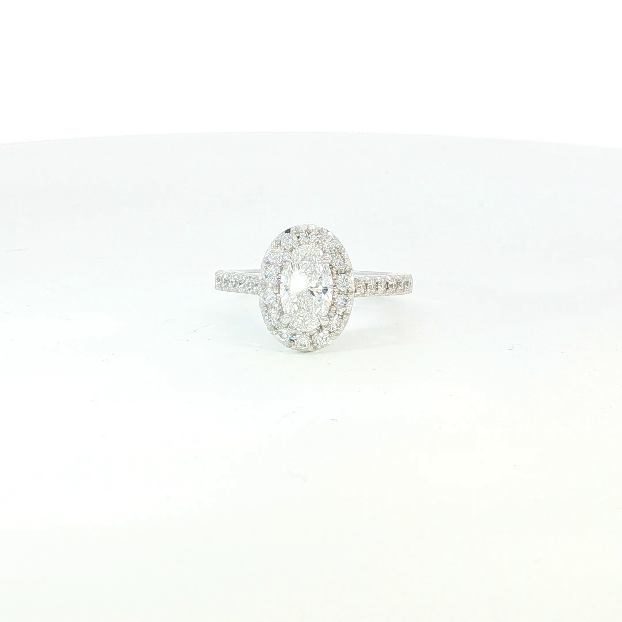 18ct WG Oval Diamond Halo Engagement Ring