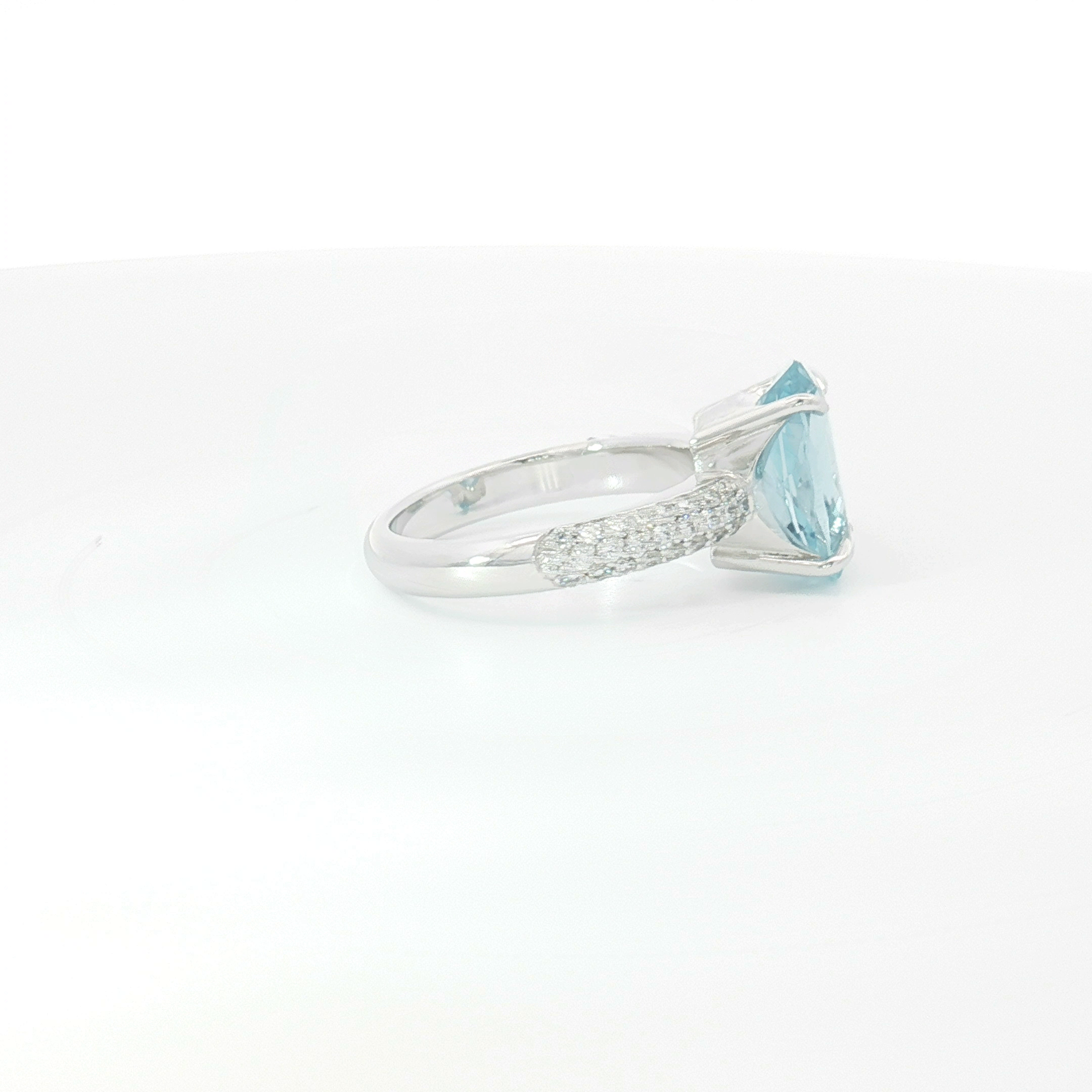 18ct WG Oval Aquamarine and Pavé Set Diamond Dress Ring